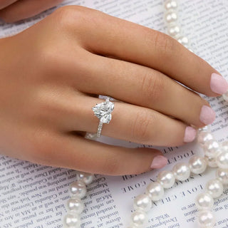 Woman sleeping peacefully with an engagement ring visible on her finger