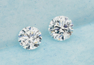 "Side-by-side comparison of a 1-carat and 1.20-carat diamond showcasing the slight size and brilliance difference to help choose the right one."