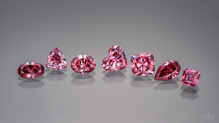 Close-up of a pink diamond set in a ring, highlighting its rarity, brilliance, and potential as a luxury investment.