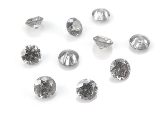 Close-up of a salt and pepper diamond ring featuring natural inclusions and a modern setting.