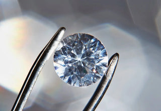 A close-up of a diamond under magnification, highlighting common blemishes and imperfections.