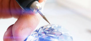 A close-up of a diamond being evaluated for resale, highlighting the distinction between natural and lab-grown diamonds.