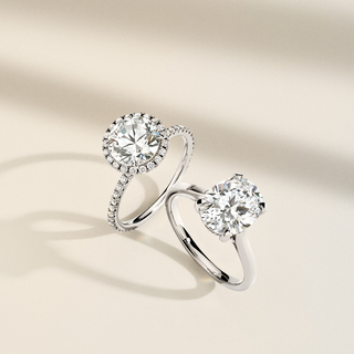 Close-up of a hidden halo engagement ring with diamonds encircling the base of the center stone, offering extra sparkle from every angle.