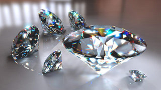 Close-up of a jeweler examining a loose diamond under magnification, highlighting the quality factors that influence its value.