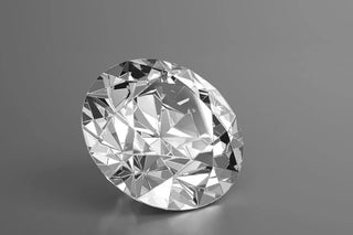 Labeled diagram of a round brilliant-cut diamond showing its facets, crown, table, and pavilion.