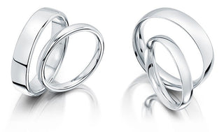 A side-by-side comparison of two wedding rings—one with a slight court profile and the other with a traditional court shape—highlighting the subtle differences in curvature, comfort, and fit.