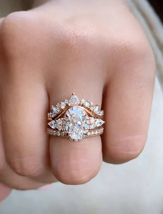 A stylish hand adorned with multiple engagement rings of different styles and gemstones—emphasizing the modern trend of embracing more than one ring to reflect personal milestones and evolving taste.
