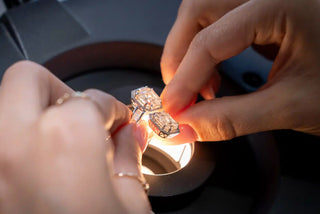 A lab-grown diamond placed next to a natural diamond with a question mark between them, symbolizing long-term value comparison.