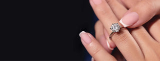 A durable round-cut diamond set in a simple gold ring, placed on a casual outfit, symbolizing everyday wearability.