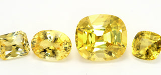 Side-by-side display of a yellow diamond ring and a yellow sapphire ring sparkling under natural light