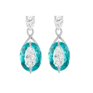 Blue Lagoon Earrings in 925 sterling silver with synthetic Paraiba stones, offering a vibrant turquoise glow.