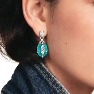 Blue Lagoon Earrings in 925 sterling silver with synthetic Paraiba stones, offering a vibrant turquoise glow.