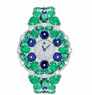 Blueberry Aurora Watch for women with a silver case, sapphire crystal dial, and glimmering green and blue stone accents.