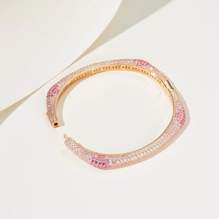 Blush Pink Bangle in 925 sterling silver with 18K gold plating, featuring pink and white lab-created sapphires in a soft, romantic design.