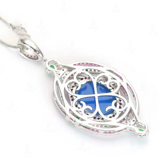 Cameo Blue Diamond Pendant in 925 sterling silver with sculpted agate cameo and a halo of lab-created sapphires in pink, green, and white tones.