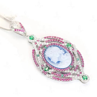Cameo Blue Diamond Pendant in 925 sterling silver with sculpted agate cameo and a halo of lab-created sapphires in pink, green, and white tones.