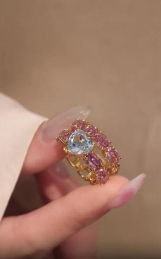 Château Heart Ring in gold-plated 925 silver with heart-shaped blue sapphire and pink halo, romantic design for women and men