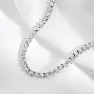 Sterling silver Classic Tennis Necklace with lab sapphires in graduated sizes, designed for elegant styling across day and evening looks.

