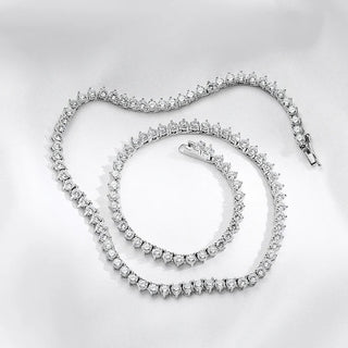 Sterling silver Classic Tennis Necklace with lab sapphires in graduated sizes, designed for elegant styling across day and evening looks.

