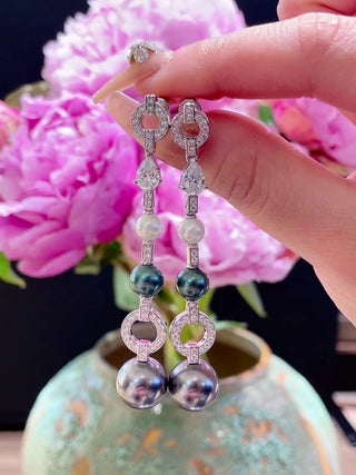 Disco Drop Pearl Earrings – Sterling silver earrings with freshwater pearls and lab-created sapphires, offering a playful, sparkling design.
