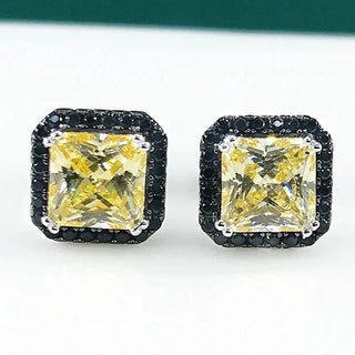 Ember Noir Studs in sterling silver with lab-created sapphires, combining minimalist design with a captivating edge.