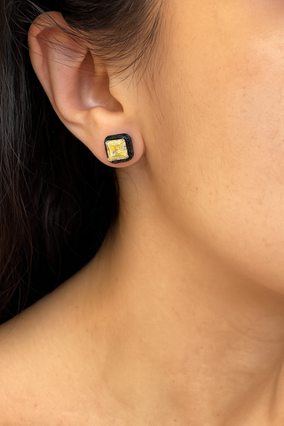 Ember Noir Studs in sterling silver with lab-created sapphires, combining minimalist design with a captivating edge.