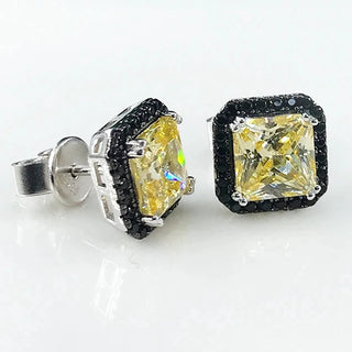 Ember Noir Studs in sterling silver with lab-created sapphires, combining minimalist design with a captivating edge.
