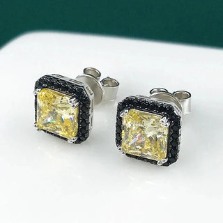 Ember Noir Studs in sterling silver with lab-created sapphires, combining minimalist design with a captivating edge.