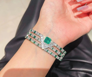Emerald Vine Bracelet in sterling silver, featuring a vivid lab-created emerald sapphire surrounded by delicate side stones, evoking natural elegance.