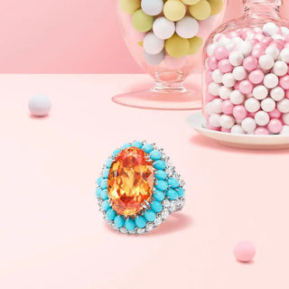 Azzallure Fire and Frost Ring in sterling silver featuring a fiery orange lab sapphire center, surrounded by icy turquoise and lab sapphires—unisex cocktail ring with elemental contrast.