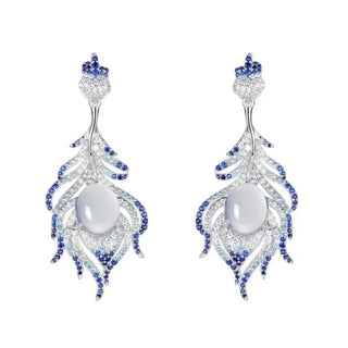 Glacial Grace Earrings: 54.6 mm drop earrings in 925 sterling silver plated with 18K white gold, set with lab-created sapphire stones.