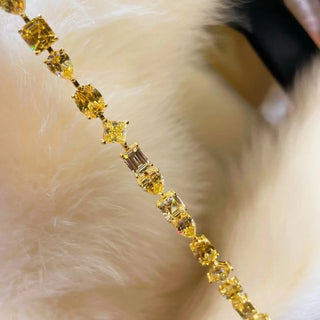 Golden Hour Bracelet in sterling silver with yellow lab sapphires – gold bracelet design inspired by sunlight and serenity.