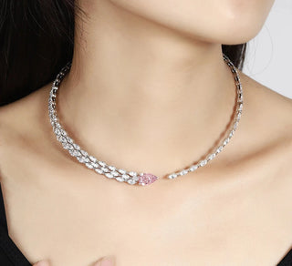Iced Out Pear Bling Tennis Necklace in 925 sterling silver with pear-shaped lab-created sapphires in pink.