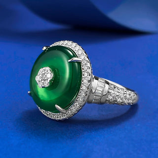 Jade Dynasty Ring featuring a natural green jade stone set in solid 925 sterling silver, framed by lab-created sapphires, symbolizing elegance and cultural significance. A timeless, versatile piece suitable as a wedding band or heirloom, combining tradition with contemporary design.