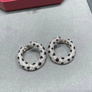Leopard Spots Earrings – Sterling silver earrings with a spotted pattern, adorned with lab-created sapphires, blending boldness and sophistication.