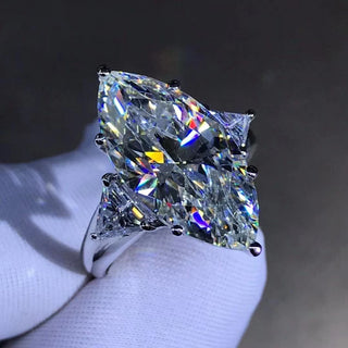 Maison Marquise engagement ring with 8-carat marquise Moissanite, diamond-style band in 925 silver, shown on hand
