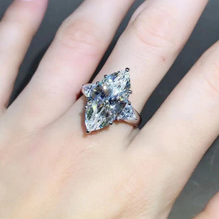 Maison Marquise engagement ring with 8-carat marquise Moissanite, diamond-style band in 925 silver, shown on hand

