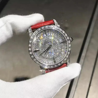 The Meridian Diamond Watch featuring a red 32 mm dial, silver case, and sapphire crystal window.