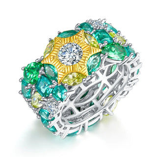 Sterling silver cocktail ring featuring lab-created sapphires in gradient hues of golden yellow, sea blue, and soft silver, designed in a prong setting to reflect light with elegance, inspired by nature's coastal and floral beauty.


