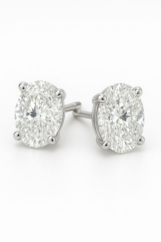 Oval cut lab grown diamond stud earrings in 18K gold (1 carat EF color, VVS clarity) for women.