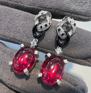 Panthera Rouge Earrings in sterling silver with a ruby center and lab-created sapphires, offering a bold, elegant design.