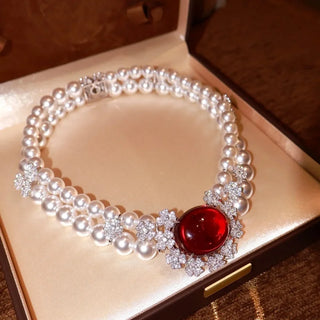 Pearl Blossom Necklace with white background- AzzallurePearl Blossom Necklace for women, crafted from 925 sterling silver with a freshwater pearl and lab-created sapphires. A delicate, nature-inspired design that rests gracefully on the collarbone.