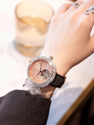 Rosaline women’s quartz watch featuring stainless steel case, sapphire crystal dial, and purple leather strap.