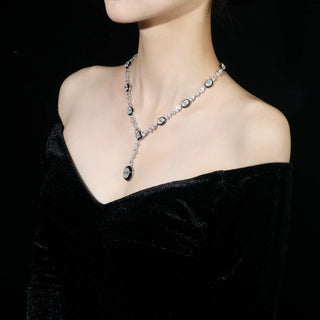 Royal Enamel Monochrome Necklace in sterling silver with platinum finish and white crystal centerpiece, displayed against a neutral background

