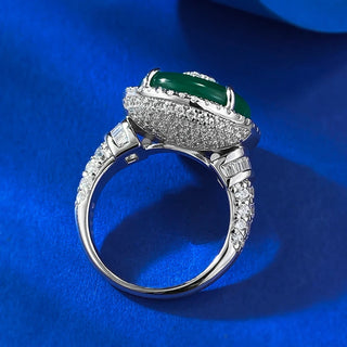 Jade Dynasty Ring featuring a natural green jade stone set in solid 925 sterling silver, framed by lab-created sapphires, symbolizing elegance and cultural significance. A timeless, versatile piece suitable as a wedding band or heirloom, combining tradition with contemporary design.