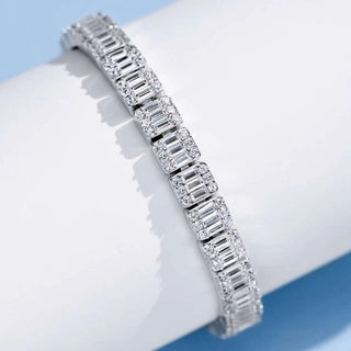 Sapphire Embrace Bracelet in sterling silver with lab sapphires – elegant women’s sapphire bangle for timeless everyday wear.