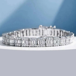 Sapphire Embrace Bracelet in sterling silver with lab sapphires – elegant women’s sapphire bangle for timeless everyday wear.