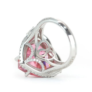 Sugar Crush Heart Ring by Azzallure featuring a pink heart-shaped lab sapphire surrounded by sparkling lab sapphires in platinum-plated sterling silver.

