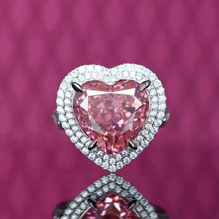 Sugar Crush Heart Ring by Azzallure featuring a pink heart-shaped lab sapphire surrounded by sparkling lab sapphires in platinum-plated sterling silver.

