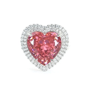 Sugar Crush Heart Ring by Azzallure featuring a pink heart-shaped lab sapphire surrounded by sparkling lab sapphires in platinum-plated sterling silver.

